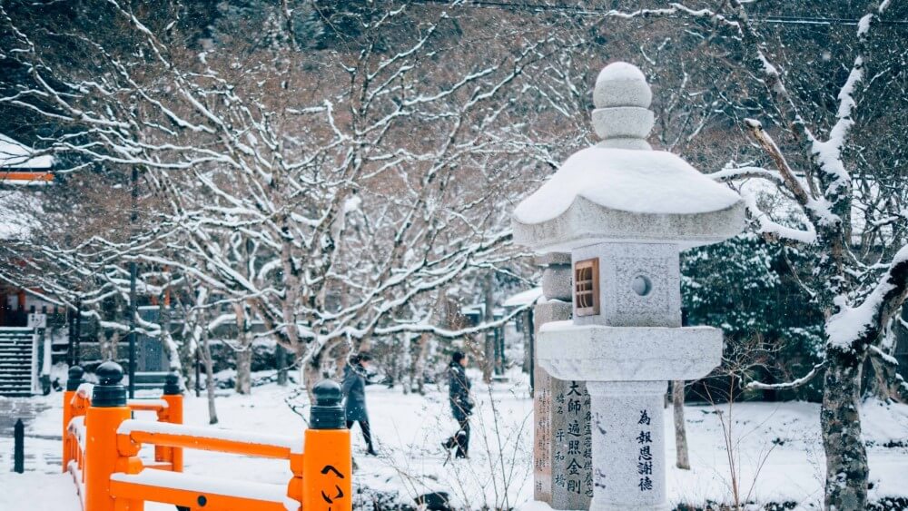 a snow covered cemetery in Japan